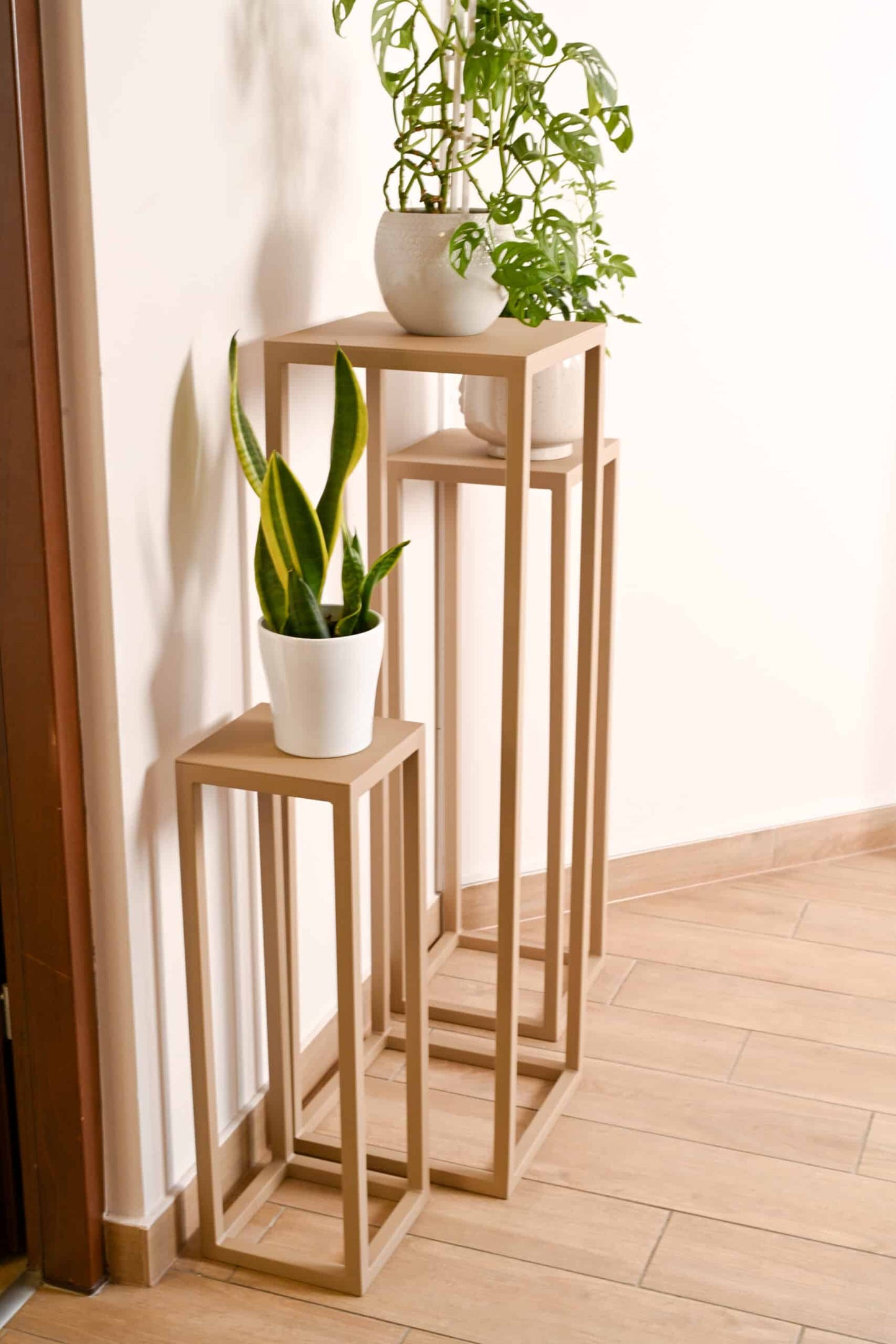 Serenity Floor Plant Stand holding potted plant in modern living room