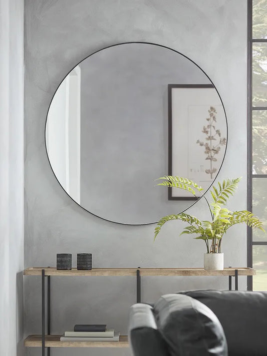 Round Horizon Wall Mirror with thin oak frame hanging above console
